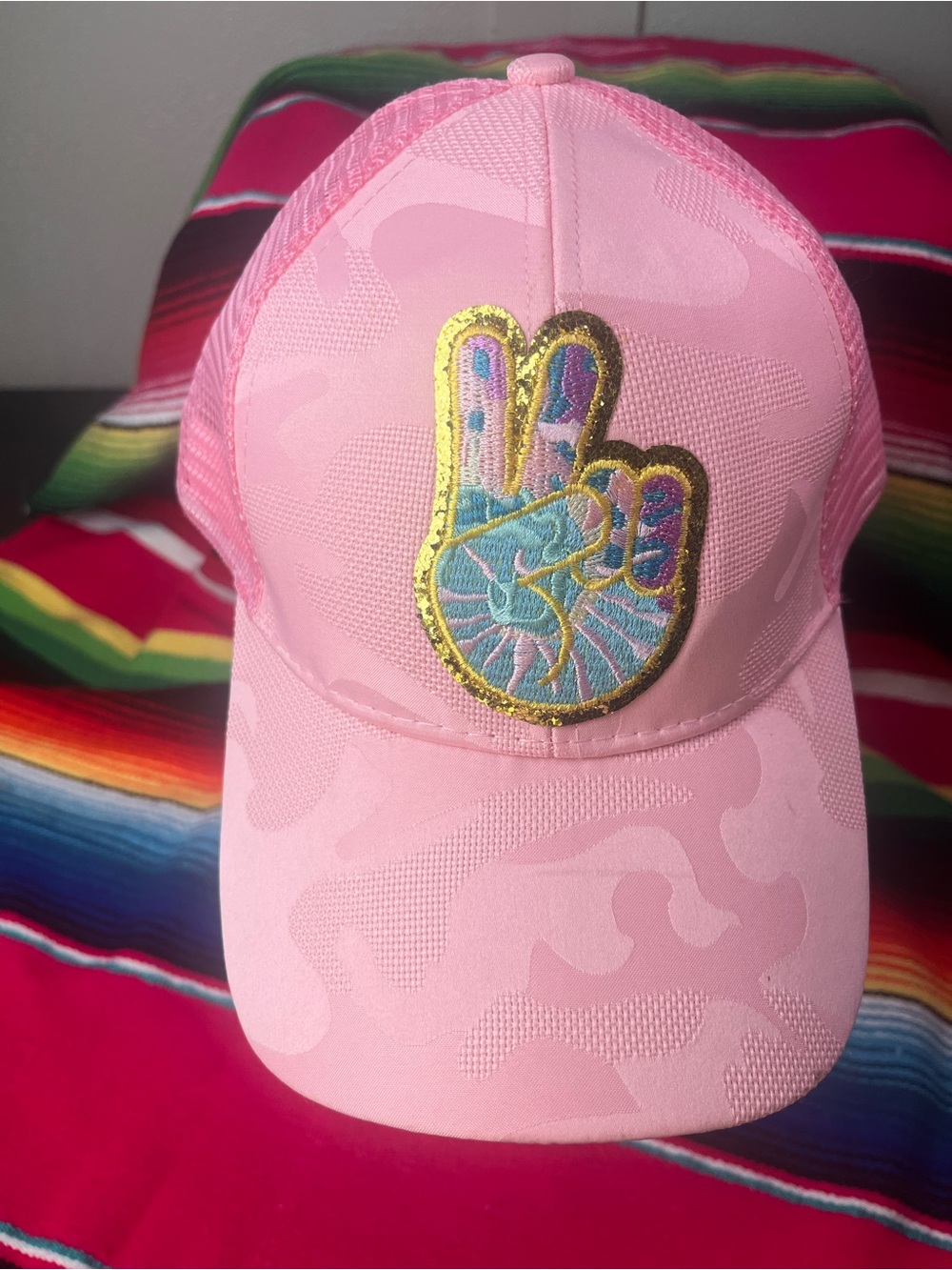 Pink Peace Sign Patch, subtle camo print, Trucker Hat with messy bun back